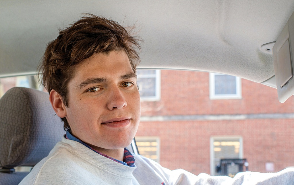 Photograph of Joey Asbel &rsquo;19 driving a car